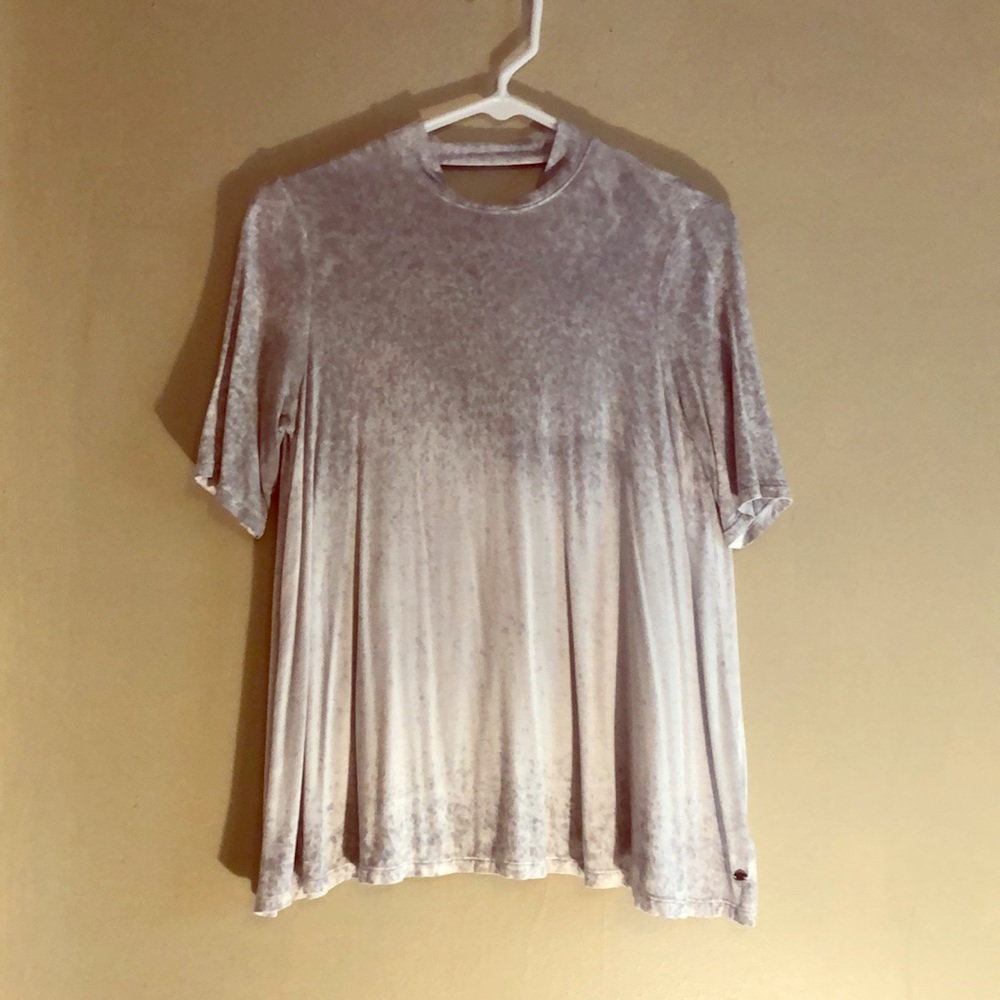 Open-back. High neck line. 3-4 sleeves